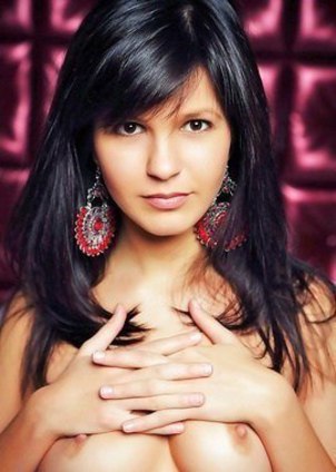 Zelda B, a young black-haired candy, getting naked