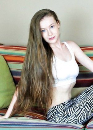 Emily Bloom has blue eyes, pale skin & long hair