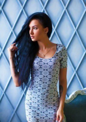 Black haired model Kris M. in sexy dress