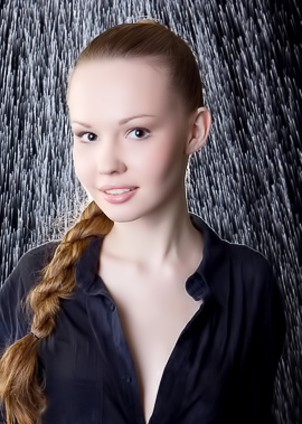 Slim babe caresses feet under streams of water.