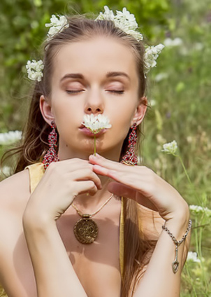 Hottie caresses herself with summer flowers in meadows