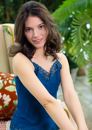 Aleksandrina Parts Her Thighs To Expose Her Shaved Pussy