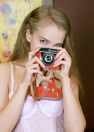 Xenia Glancing Back Over Her Shoulder With A Flirtatious Smile