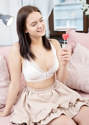 Tina Howl Flirty Look In Her Gorgeous Blue Eyes As She Sucks Her Lollipop