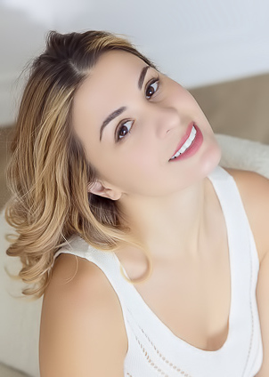 Alice Kelly Dark-eyed Siren Smiles Enticingly As The Straps Slide From Her Shoulders