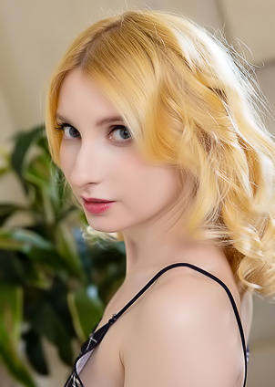 Minnie Lighter Squeezing Her Gorgeous Breasts And Smiles Seductively