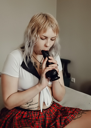 Sem Retlick Grabs Her Ass Enticingly In A Plaid Skirt And Black Pantyhose