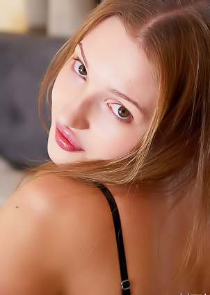Ninna Flirts playfully with the pillows in her bedroom