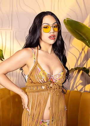 Malayas Velvet Lingerie Contrasts with Couchs Rough Fabric