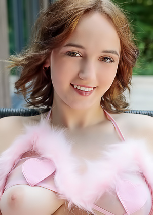 Rokki Gauges You With A Sly Glance As She Gets Comfortable In Her Pink Feathers